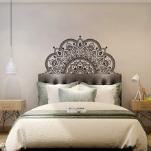 Load image into Gallery viewer, A bedroom with a black and white mandala-patterned wall decal on the wall above the bed.