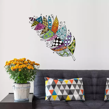 Load image into Gallery viewer, A colorful wall decal of a stylized feather design applied on a wall - Removable wall decals NZ