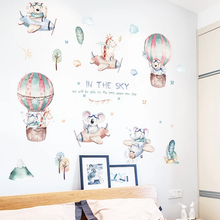 Load image into Gallery viewer, Colorful wall decals featuring cartoon animals in a hot air balloon setting with the text 'In the sky'.