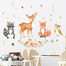 Load image into Gallery viewer, A colorful wall decal featuring cartoon animals such as a deer, fox, and squirrel surrounded by floral elements and small animal motifs on a white wall.